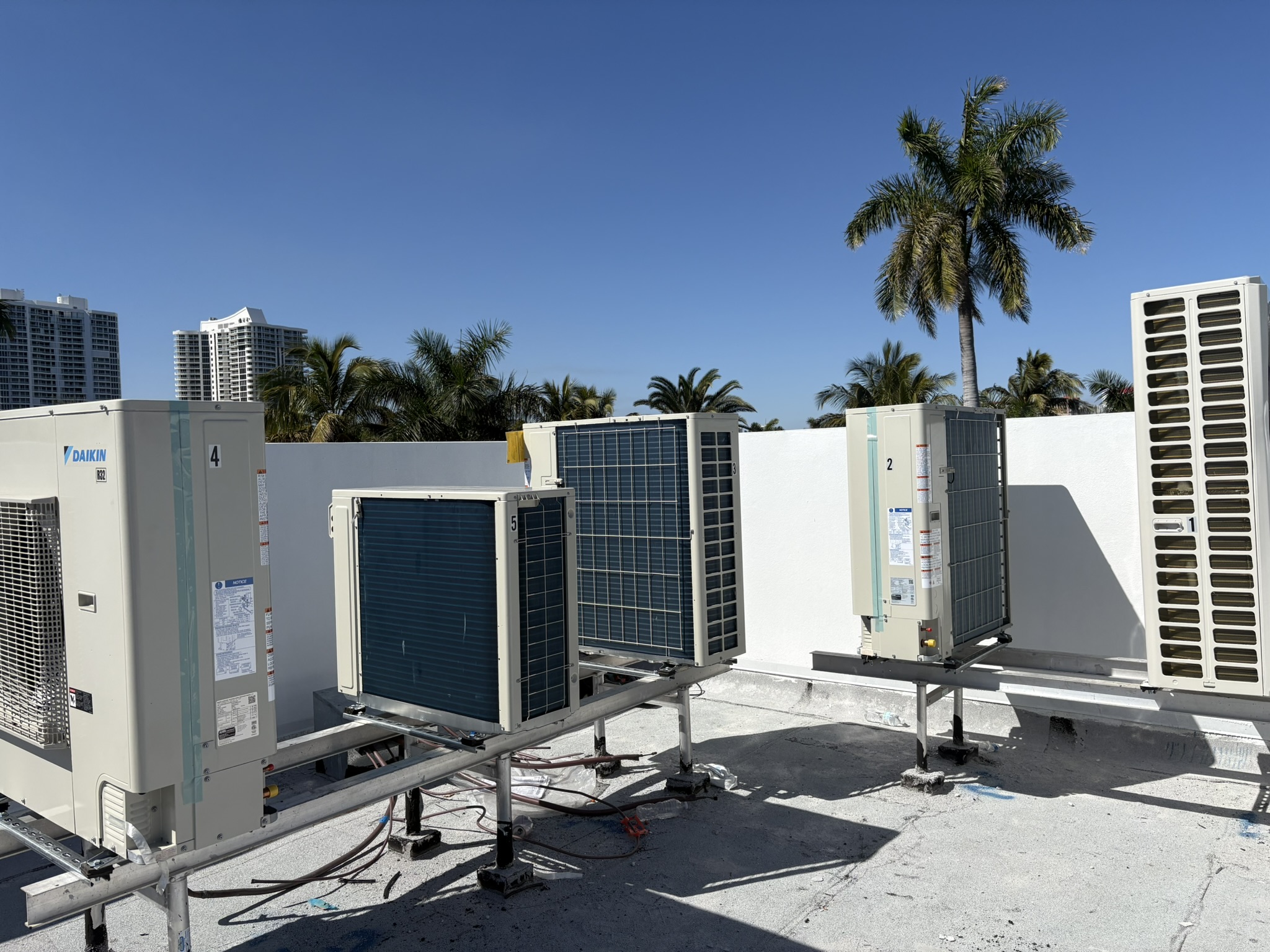 Right-BTU crew managing rooftop HVAC units on a commercial property