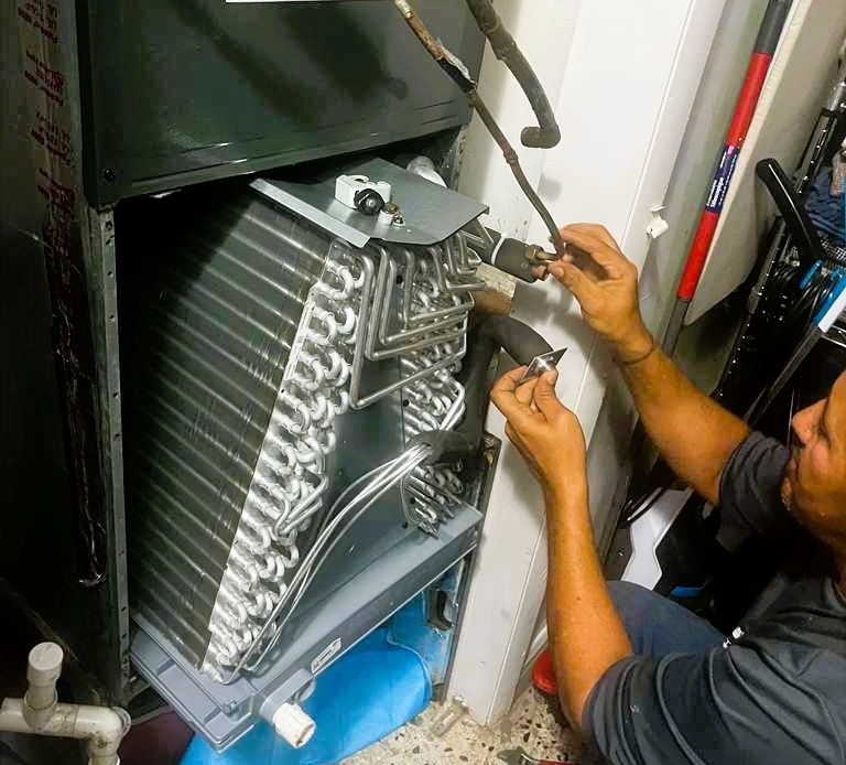 Right-BTU technician performing advanced diagnostics on a commercial HVAC unit